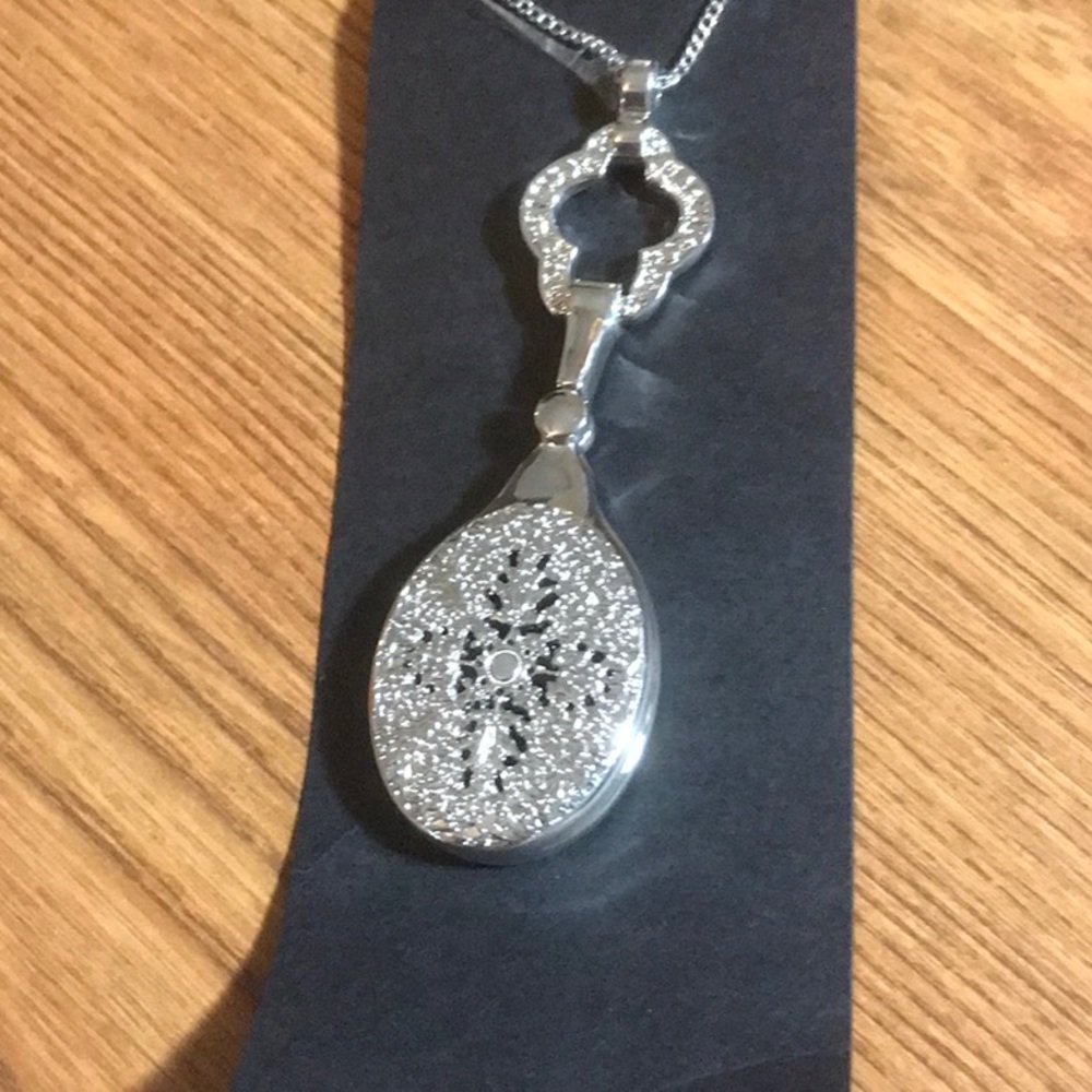 Elegant Silver toned Pendant Necklace with magnifying glass